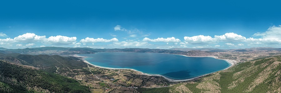 Blue waters and volcanic peebles of magical Salda Lake in Burdur, Turkey.