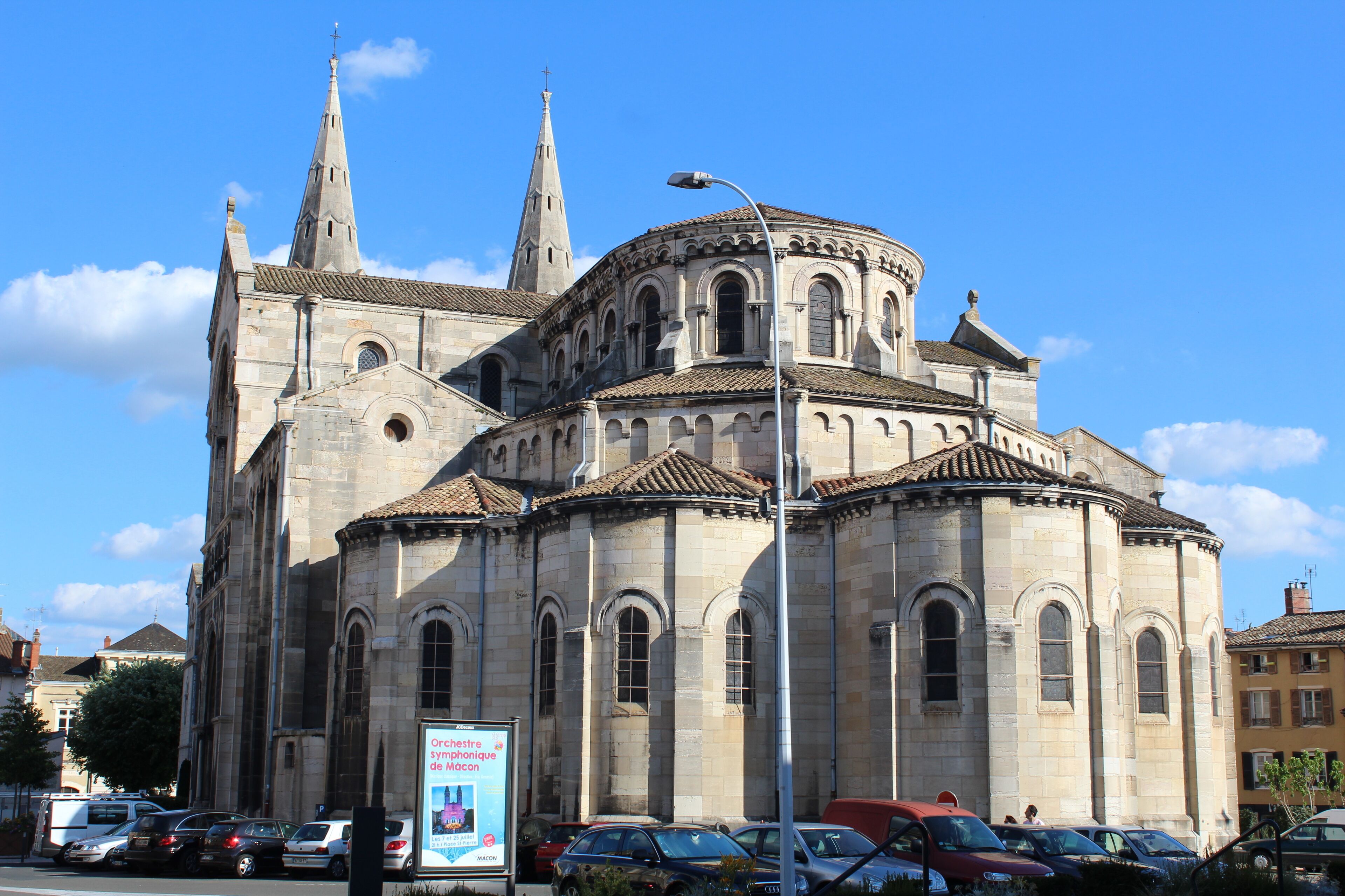 A historic church with two spires and a round central section.