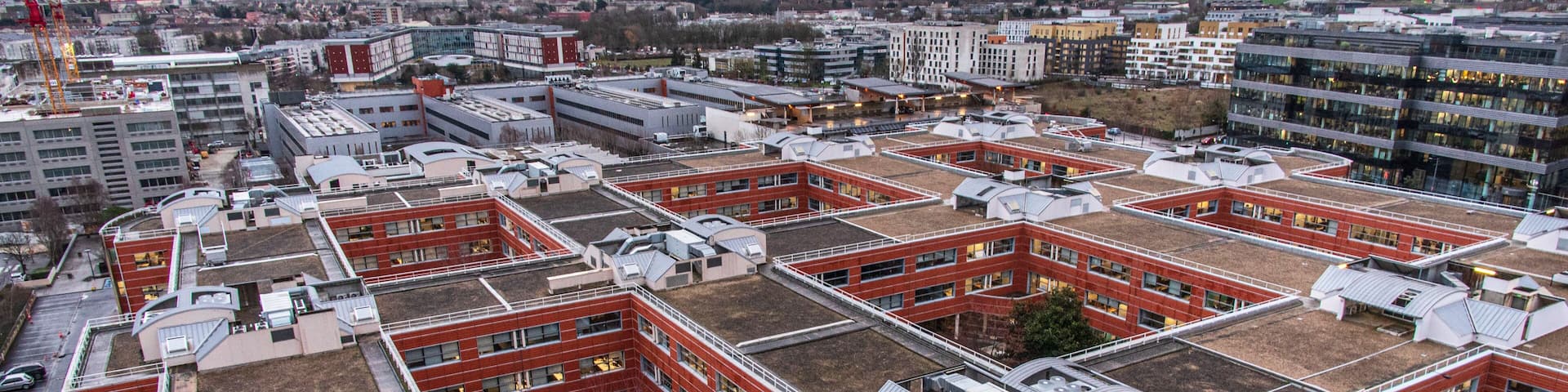 The town of Massy with its residential and industrial buildings lit up at night in the Parisian suburbs in France