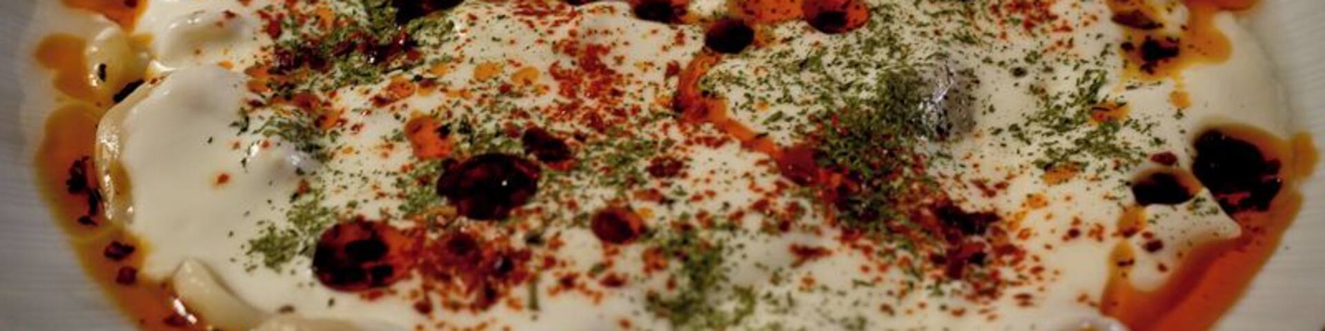 Turkish food is one of our favourites, and this dish of manti beats them all. A small ravioli type pasta (filled with spiced meat), covered in a yogurt sauce with chili oil and dill.
We enjoyed it in many places throughout Turkey, but it was in the small town of Burhaniye in the northwest where it was the very best.