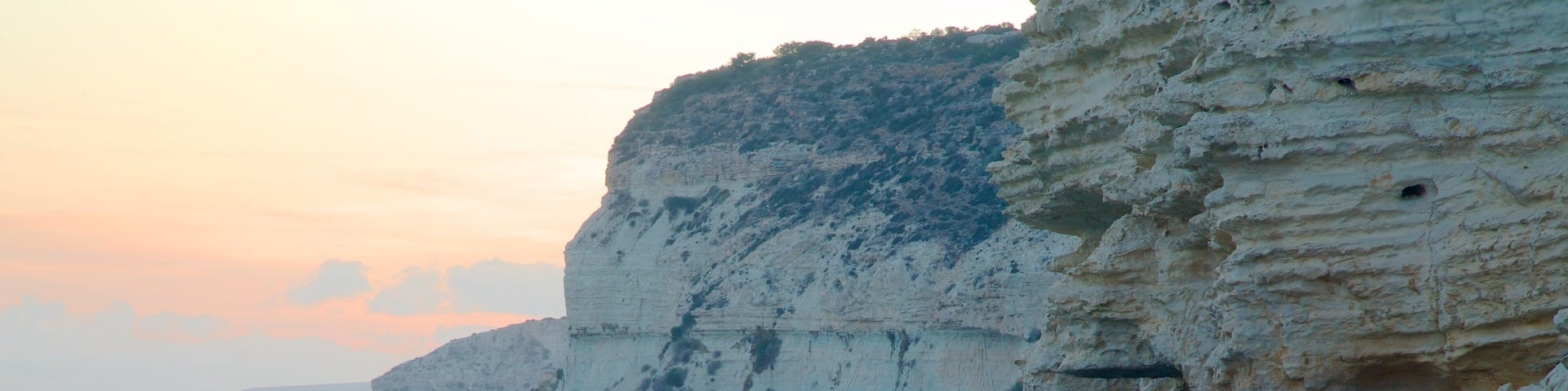Cyprus showing a sunset and rugged coastline