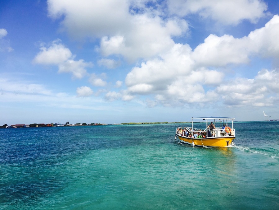 Ferry boat carrying passengers to De Palm island. This off-shore all inclusive resort includes unlimited drinks and buffet, activities such as zip lining, snorkel and bananaboating and a water park! A fun family all day adventure!