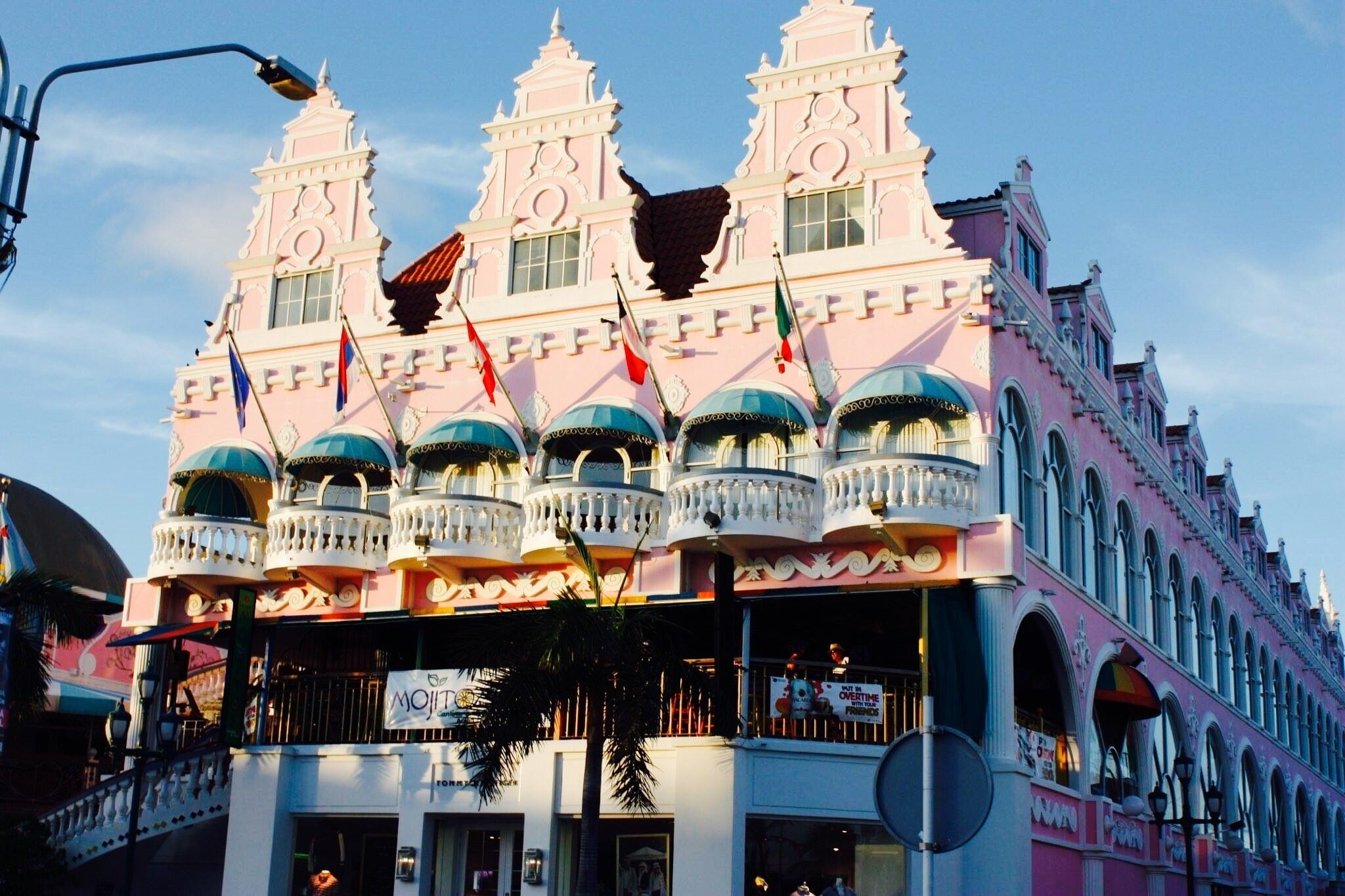The Royal Plaza Mall is the most traditional shopping area in Oranjestad. This very pink and ornate building houses an attractive collection of shops that offers a little bit of everything. It is conveniently located right across the cruise ship terminal right in the middle of Oranjestad, walking distance to the bus station, museums , galleries and shopping malls.