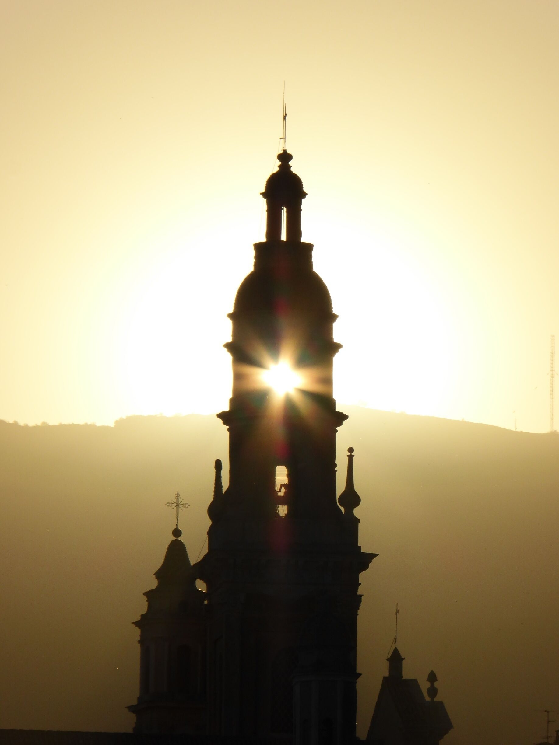 The sun setting through the Basilique Saint Michel Archange in Menton