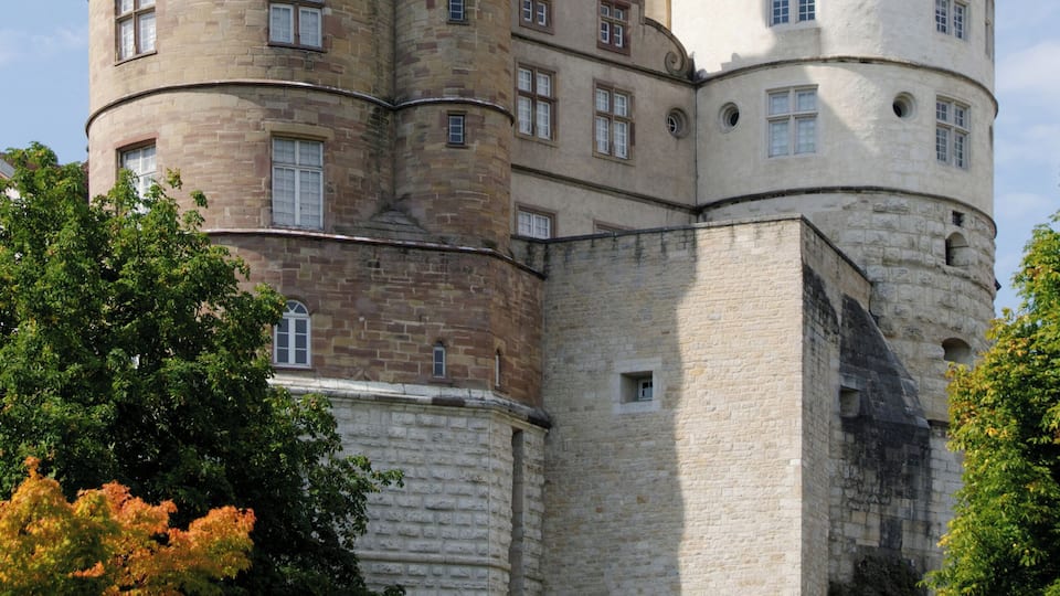 A historic castle with multiple towers and a large central building.