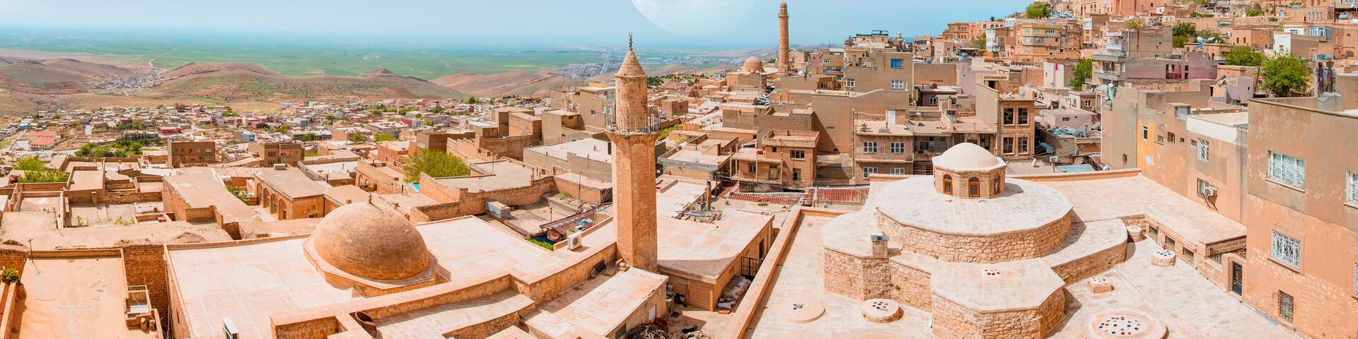 Traditional pink stone houses of Mardin Old town with full moon - Mardin, Turkey "Elements of this image furnished by NASA "