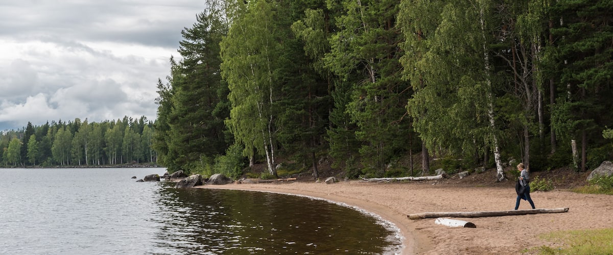 Segersta, Bollnas Municipality Sweden - Woman near the water at a natural lake