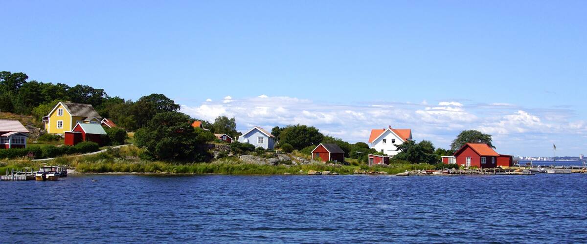 A coastal village with colorful houses by the water.