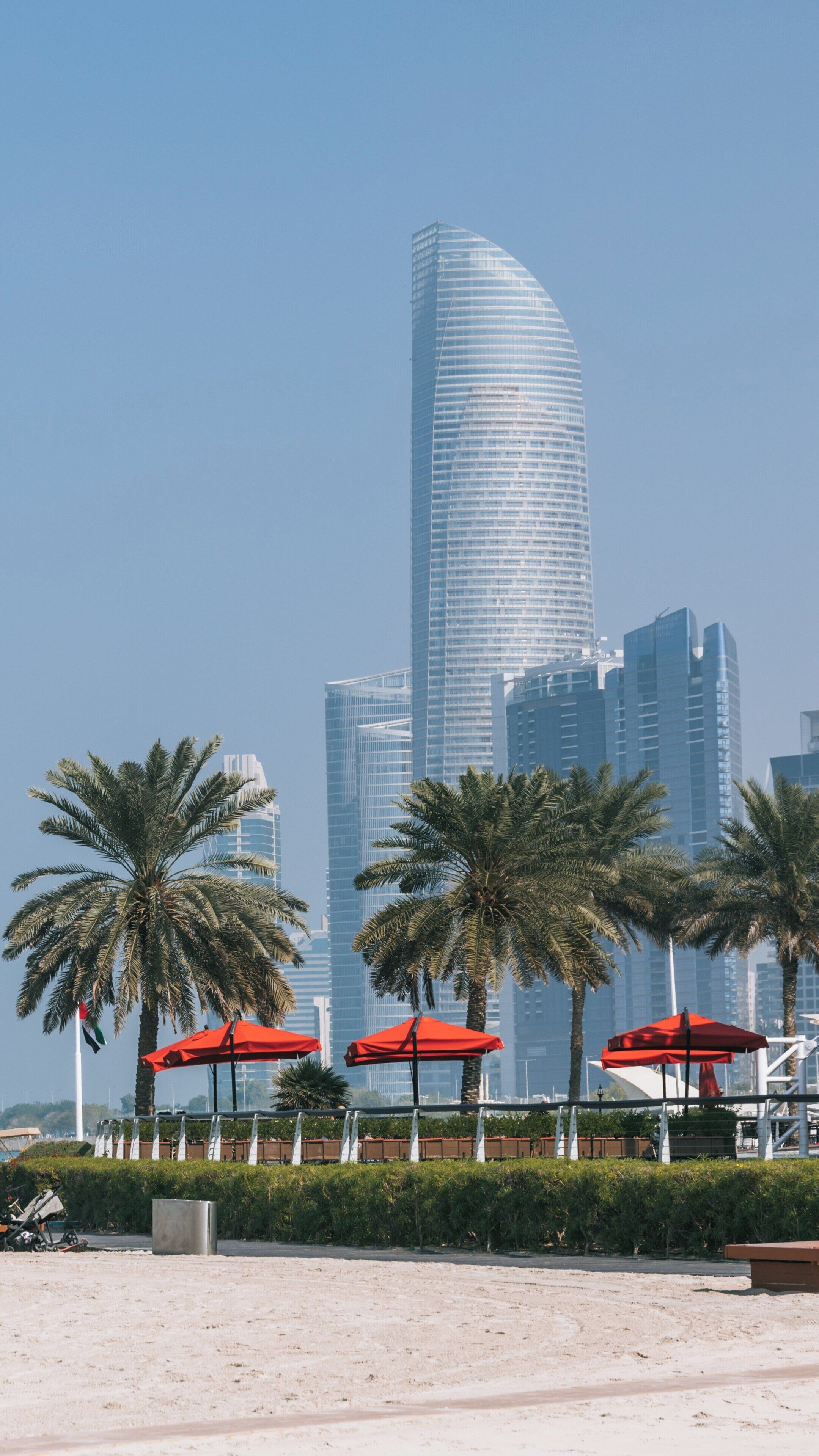 Discovering the beauty of Corniche Beach in Abu Dhabi with stunning views of modern skyscrapers under a clear blue sky