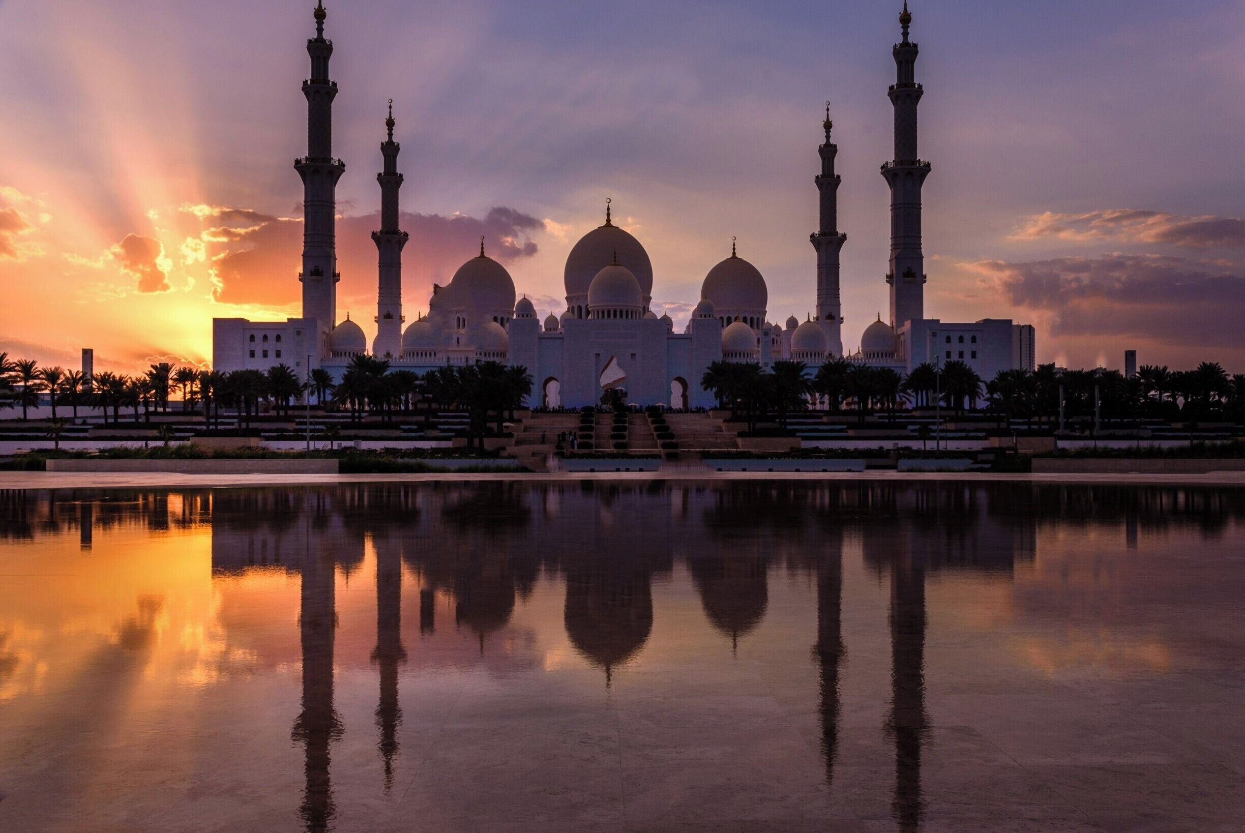 Sheikh Zayed Grand Mosque located in Abu Dhabi, UAE. Incredible Islamic architecture featuring numerous domes, minarets, inlaid precious stones on columns, one of a kind hand made carpet, plus much more. This complex will accommodate 40,000 worshippers at one time. 