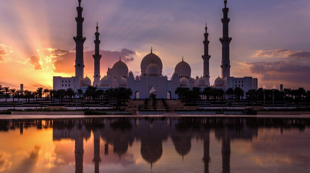Sheikh Zayed Grand Mosque located in Abu Dhabi, UAE. Incredible Islamic architecture featuring numerous domes, minarets, inlaid precious stones on columns, one of a kind hand made carpet, plus much more. This complex will accommodate 40,000 worshippers at one time.