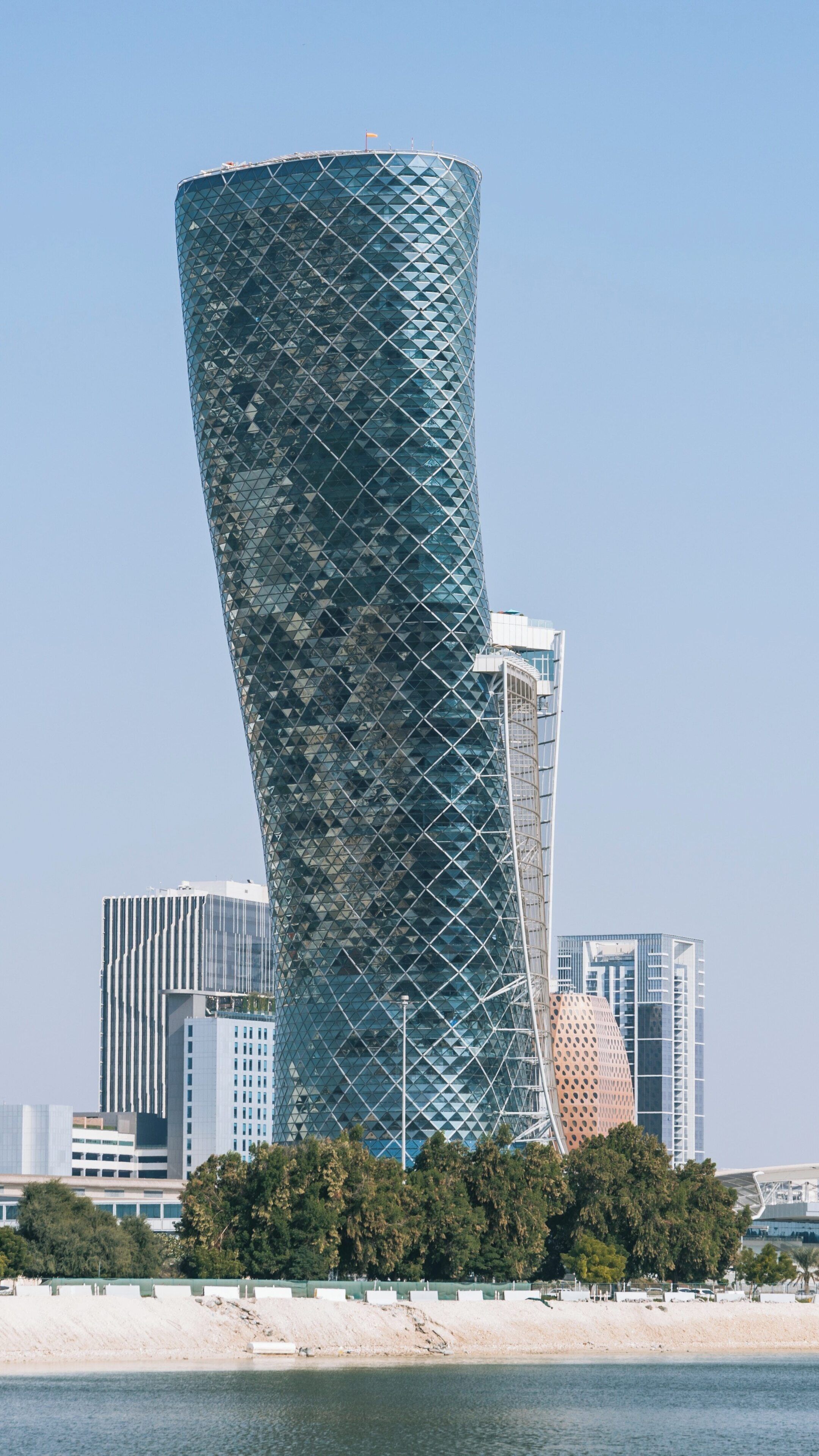 Iconic design of Abu Dhabi National Exhibition Centre in the vibrant city skyline of Abu Dhabi, showcasing modern architecture and cultural significance