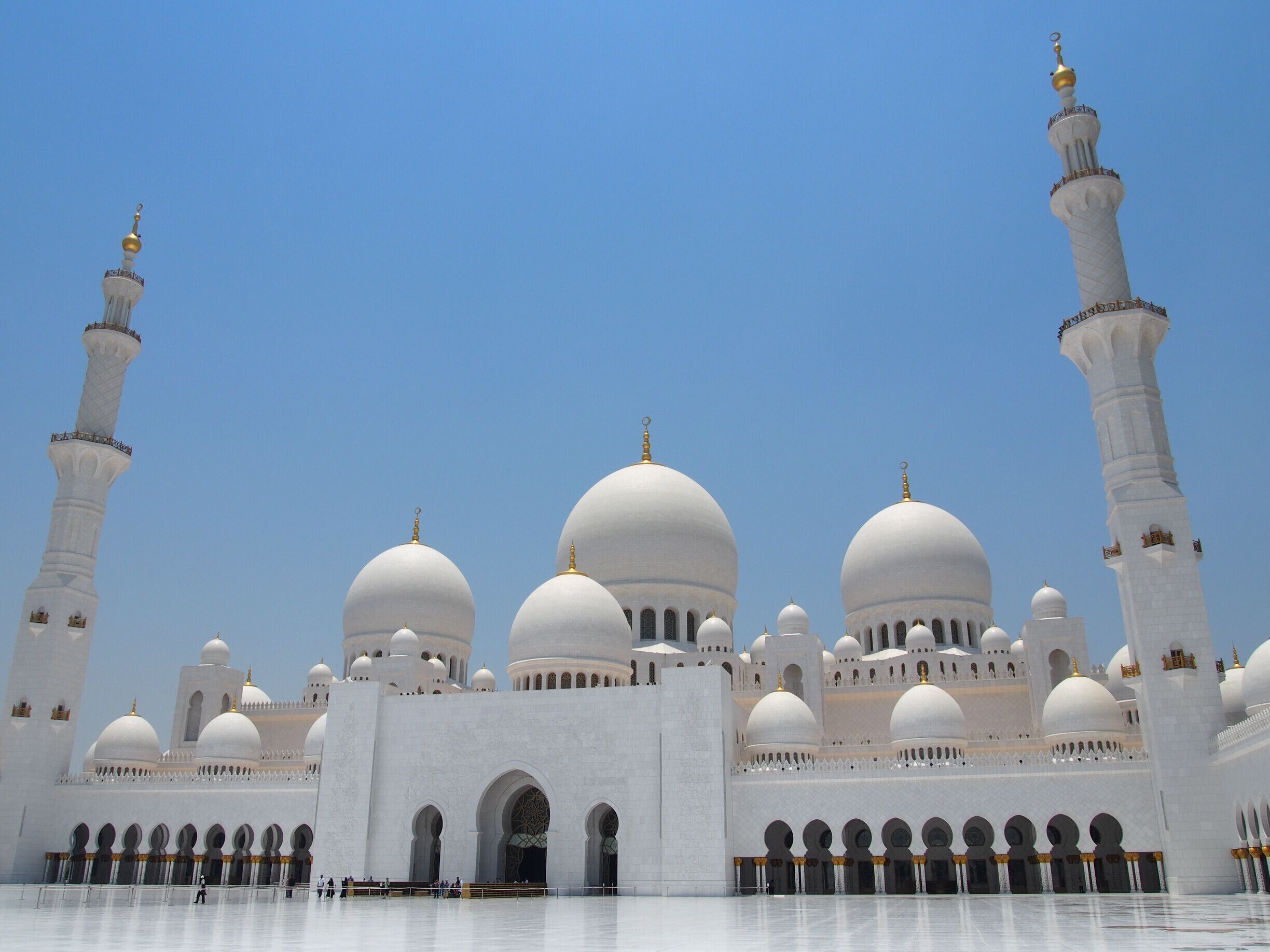 Exterior of the Sheikh Zayed Mosque in Abu Dhabi.

The gleaming white marble structure is massive, holding up to 40,000 worshipers at one time. It shimmers in the desert heat. The vast marbled courtyards punctuated by archways, mosaic tile surfaces, pools and fountains make it truly a gorgeous site to behold.

#architecture