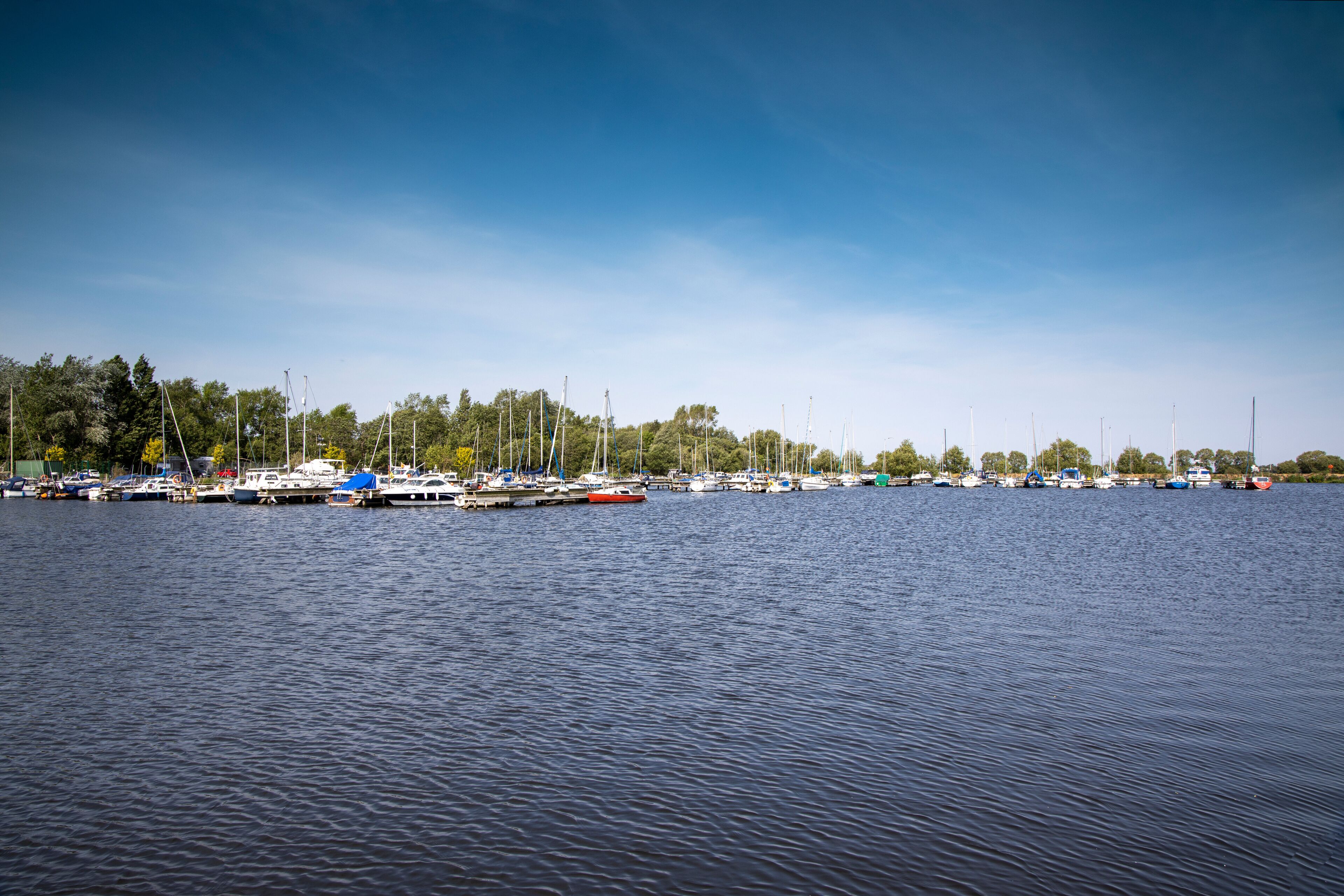 View of boats moored at Kinnego marina , Lough Neagh, near Lurgan, Northern Ireland on a warm sunny spring day