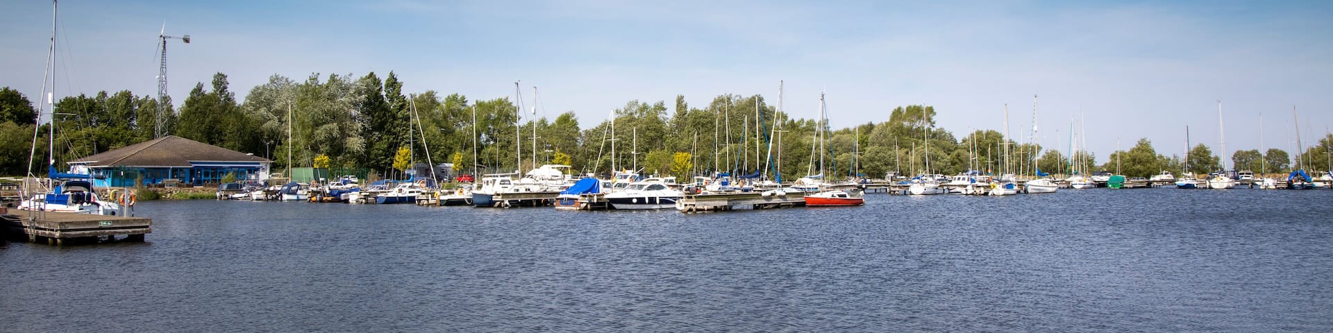 View of boats moored at Kinnego marina on Lough Neagh on a warm sunny spring day