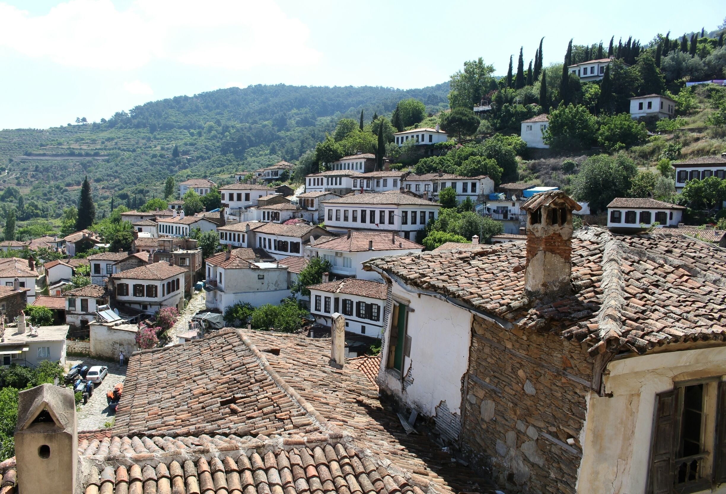 A hillside village with terracotta-tiled roofs and white-washed buildings.