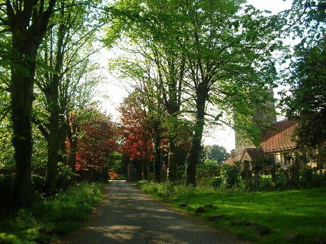 Church of England parish church of St Blaise, Milton, Vale of White Horse, Oxfordshire (formerly Berkshire), England; with the driveway to the Manor House.