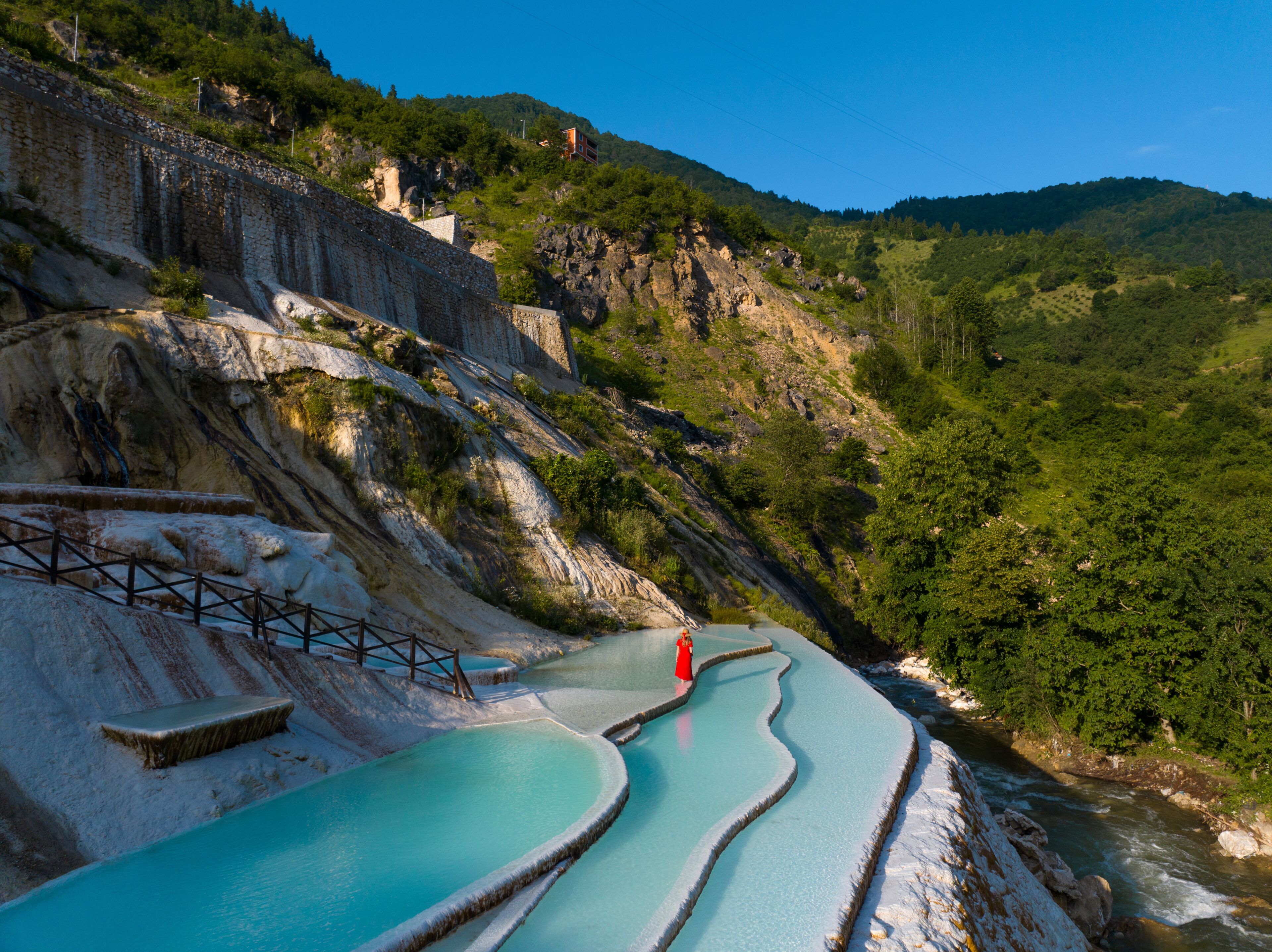 Woman in Red Dress on the Turquoise Travertines Drone Photo, Göksu Travertines Dereli, Giresun Turkey (Turkiye)