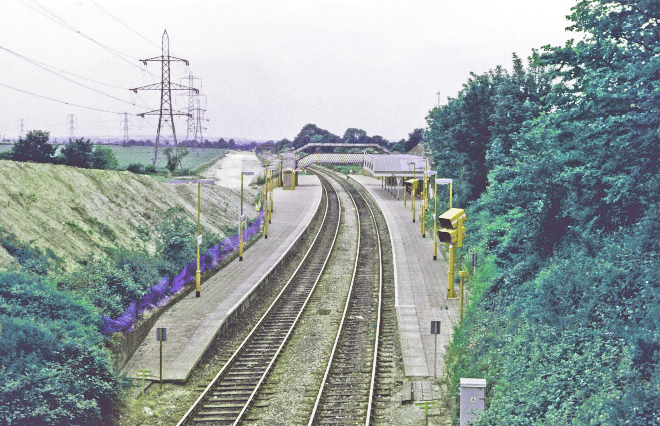 Wendover Station, 1996. View NW, towards Aylesbury etc.: ex-Metropolitan & GC Joint, later LPTB Metropolitan Line, London (Baker Street/Marylebone - Amersham - Aylesbury - (until 9/66) Quainton Road, then ex-GCR to Leicester, Nottingham, Sheffield etc. (The new A413 by-pass road is being built, to the left).