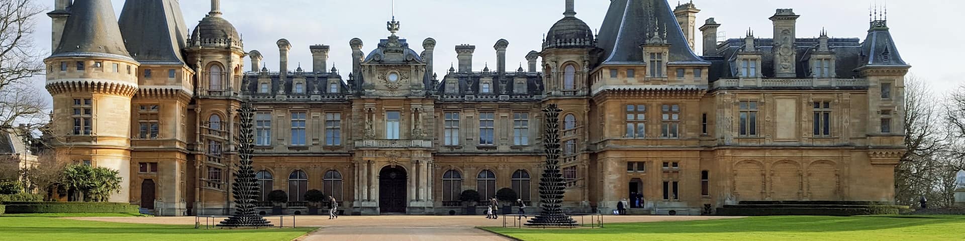 A grand historic building with multiple towers and a central entrance.