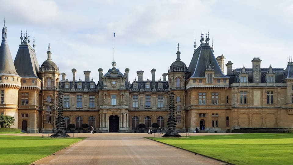 A grand historic building with multiple towers and a central entrance.