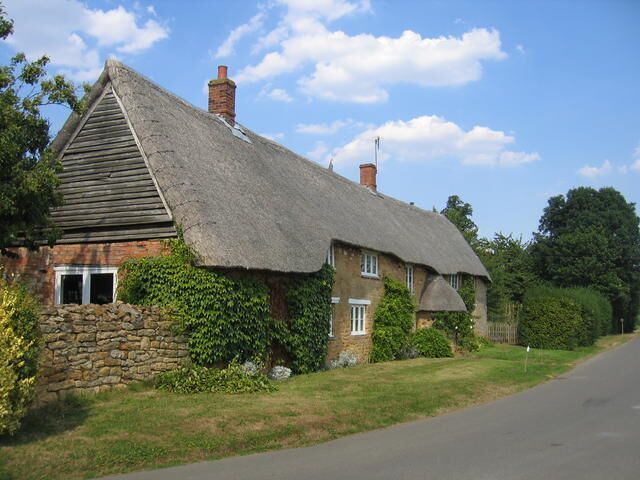 Cottages at Sutton-under-Brailes. A row of thatched cottages beside the lane approaching the villages from the west near the church.