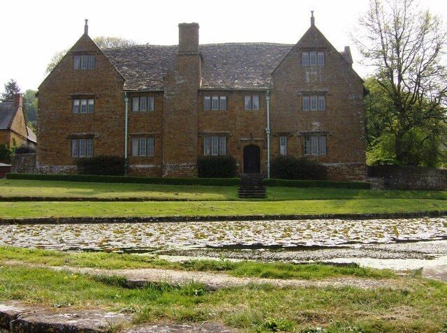 Manor house at Warmington. The 17th century manor house has a commanding view over the village pond (foreground). This picture looks in the other direction 461493.