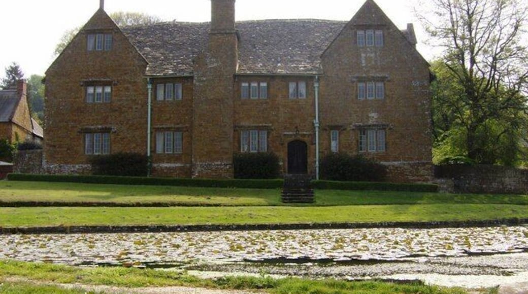 Manor house at Warmington. The 17th century manor house has a commanding view over the village pond (foreground). This picture looks in the other direction 461493.