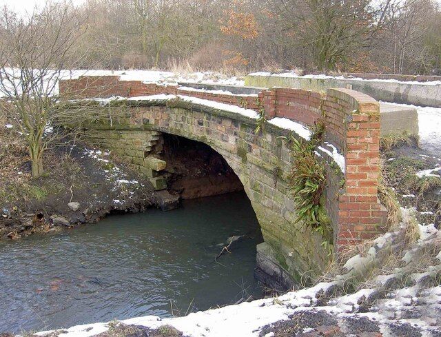 Bridge over the River Dove The former Darfield Main Colliery was in the background. The bridge carrying a path from Littlefield Lane has been badly damaged by floods.