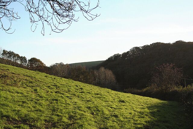 Loxhore: valley near Loxhore Cott Looking south. Nearby in the roadside is an old milestone with the inscription '6 Barnum', or in other words six miles to Barnstaple