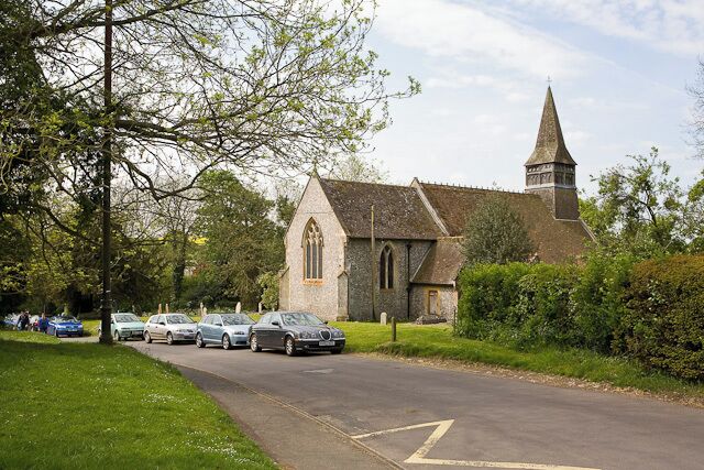 St Michael's Church From Steventon Road, with a Sunday morning service underway.