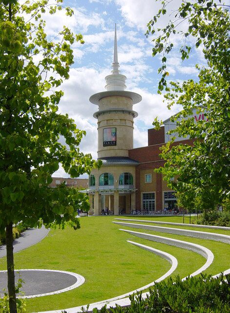 Festival Place and amphitheatre This round tower at the easternmost end of the Festival Place shopping centre overlooks a grass amphitheatre. There are numerous restaurants at this end of Festival Place, and a large "vue" cinema (visible to the right of the tower) occupies the floor above.