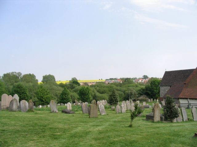 St Mary's Overton churchyard The churchyard looks out over the road to the far side of the valley.