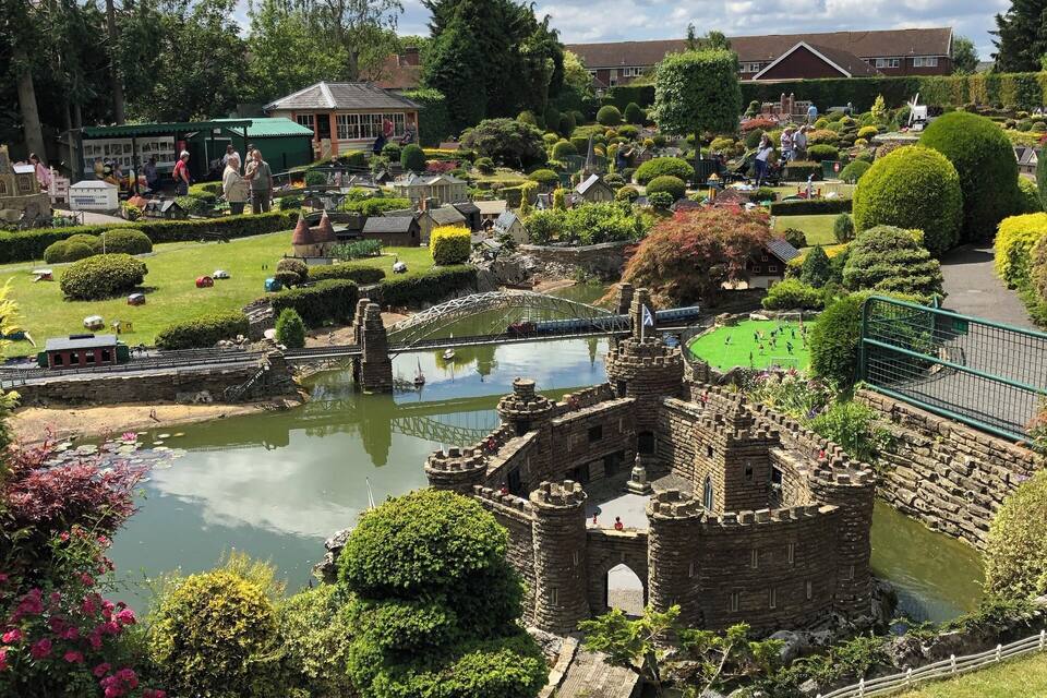 A model village with a castle, a pond, and various model buildings.