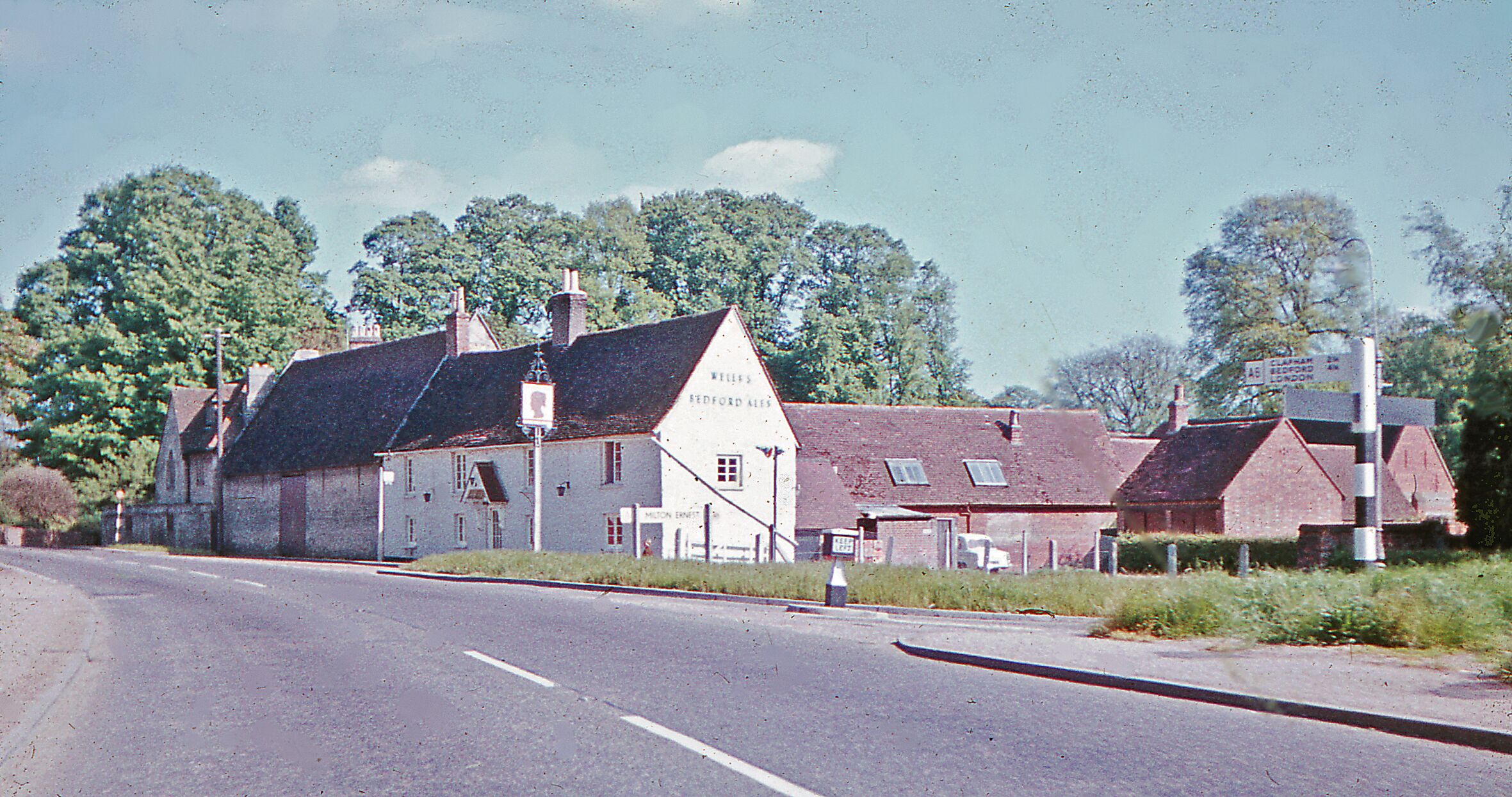 Milton Ernest, 1962: SE on A6, Rushden Road. View SE, towards Bedford, Luton and London, passing the Queen's Haed. Compared to 50 years later, a rural retreat?
