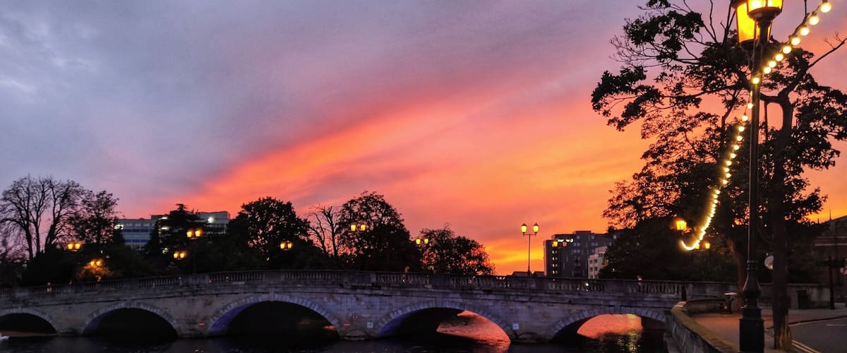 Sunset over town bridge in the center of Bedford. The current bridge was opened in 1813 on the site of a previous much older bridge.