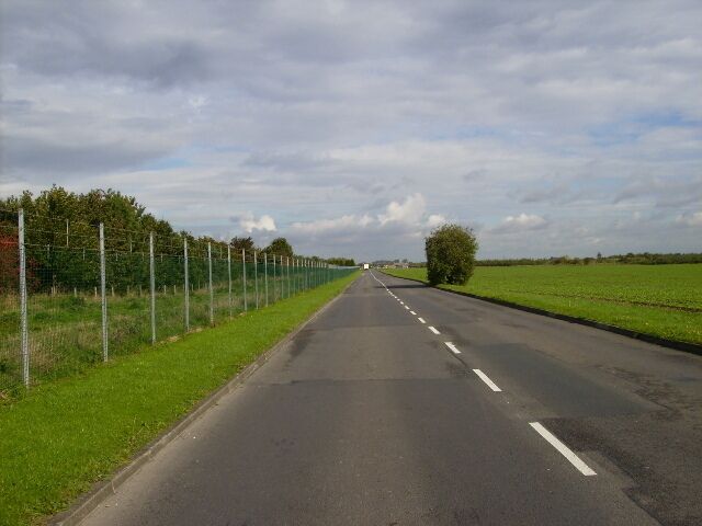 Access road into Normanby Barracks Leconfield, East Riding of Yorkshire, England. The camp perimeter fence is on the left of the picture.