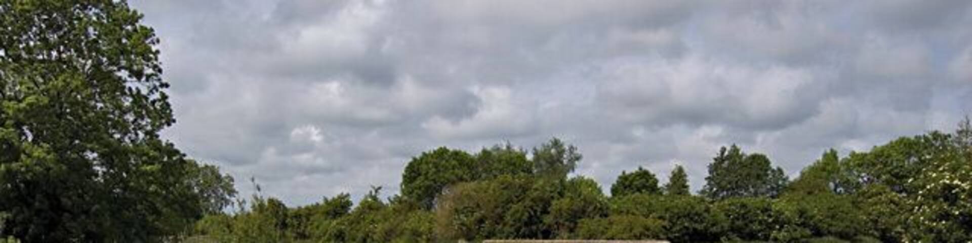 Sandholme Viaduct, Leven, East Riding of Yorkshire, England. The brick parapet visible in the centre of the picture is where the Leven Canal crosses over the Burshill and Barff Drain. The three and a quarter mile long canal links Leven with the River Hull. It operated between 1805 and 1935 but is now closed to traffic and designated a Site of Special Scientific Interest.