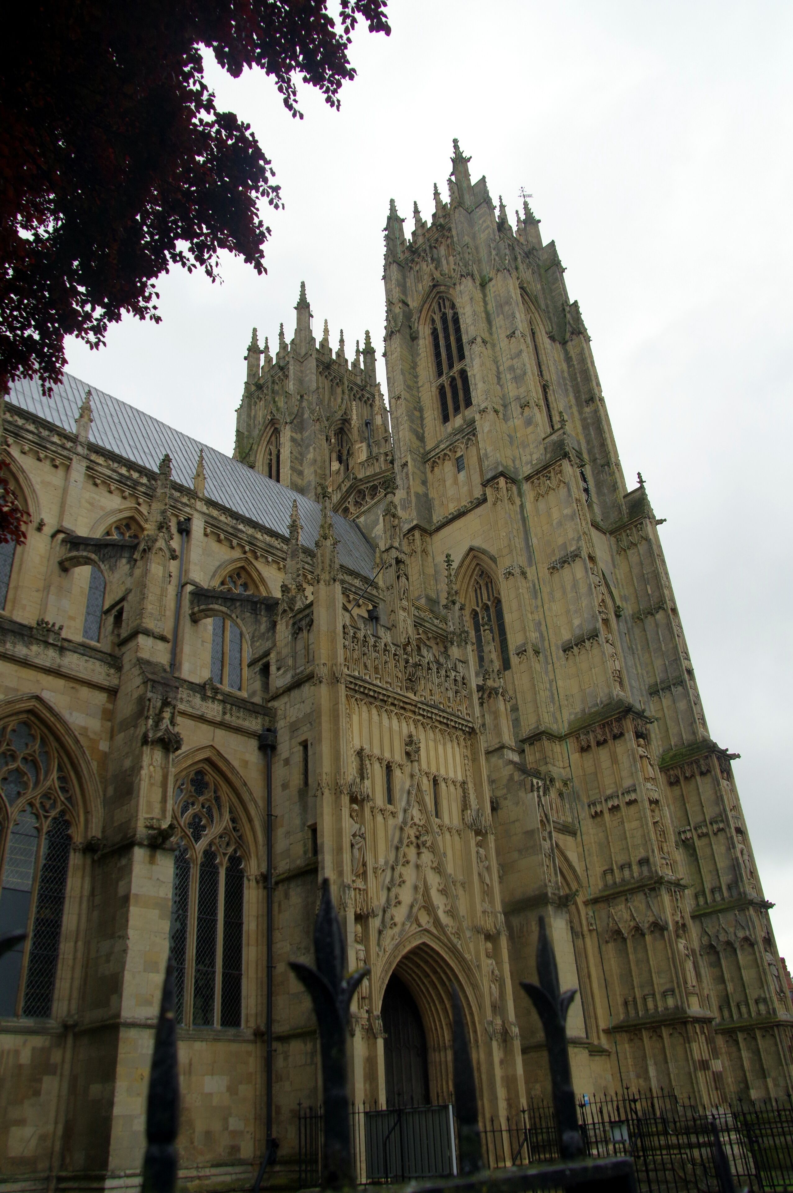 A Gothic cathedral with intricate stonework, pointed arches, and a tall spire.