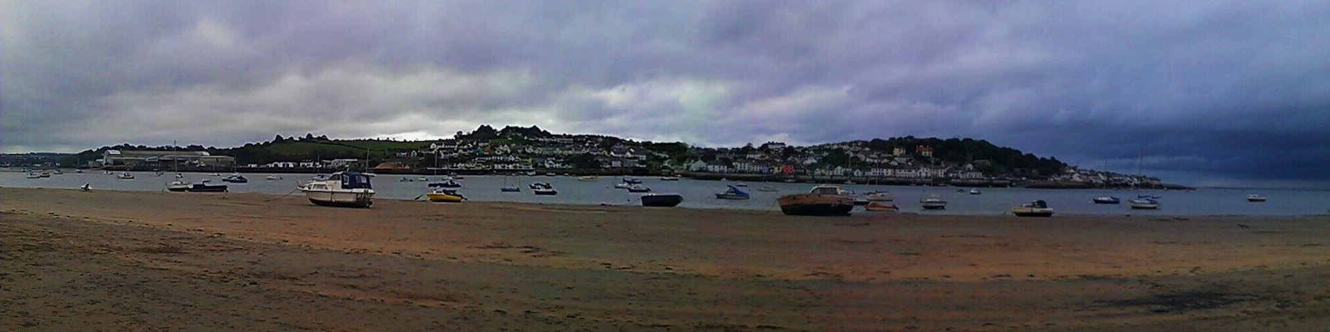 Panoramic photograph of the beach at Instow, Devon, overlooking the town of Appledore.