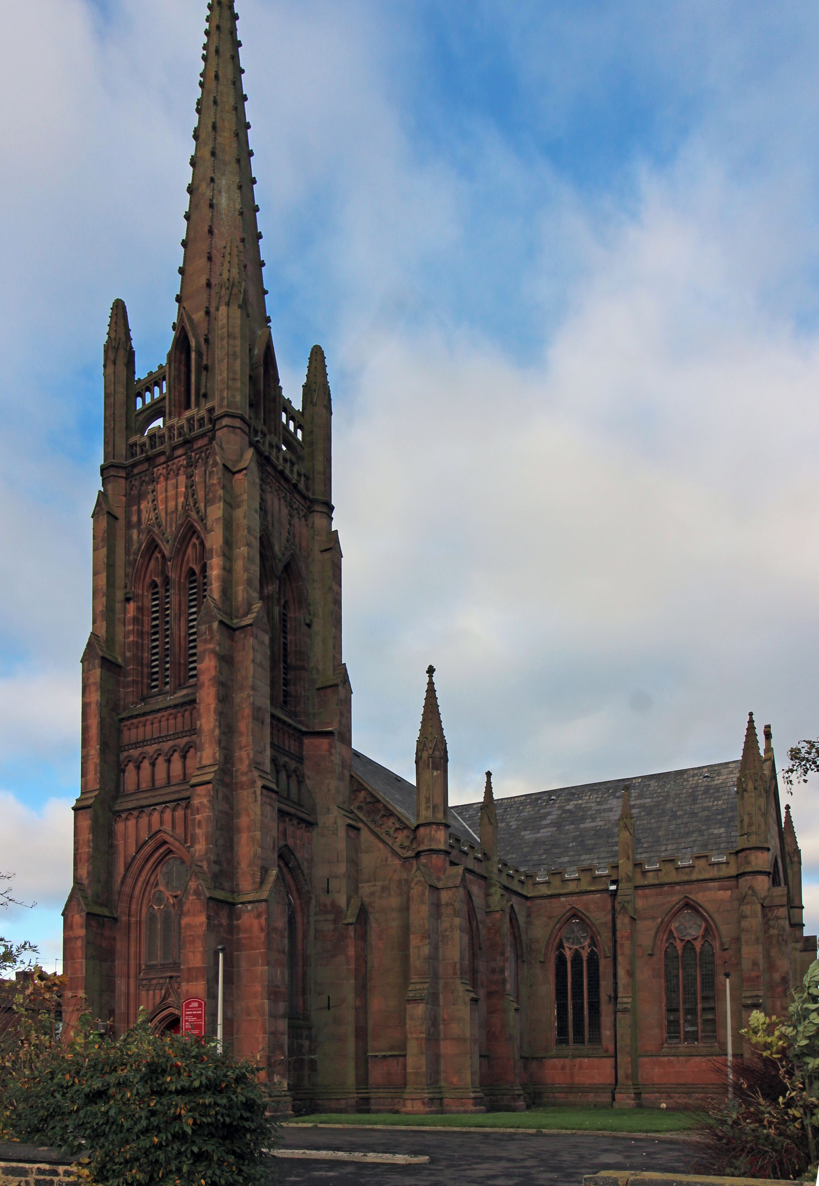 A Gothic-style church with a tall spire and multiple pointed arches.