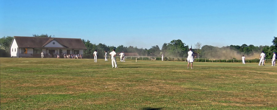A public Herts and Essex League Saturday cricket game between Little Hallingbury CC and Thorley CC (Thorley batting), at Gaston Green, Little Hallingbury, Essex, England in 2018. Camera: Canon PowerShot SX60 HS Software: File lens-corrected, optimized, perhaps cropped, with DxO PhotoLab, and likely further optimized with Adobe Photoshop CS2.
