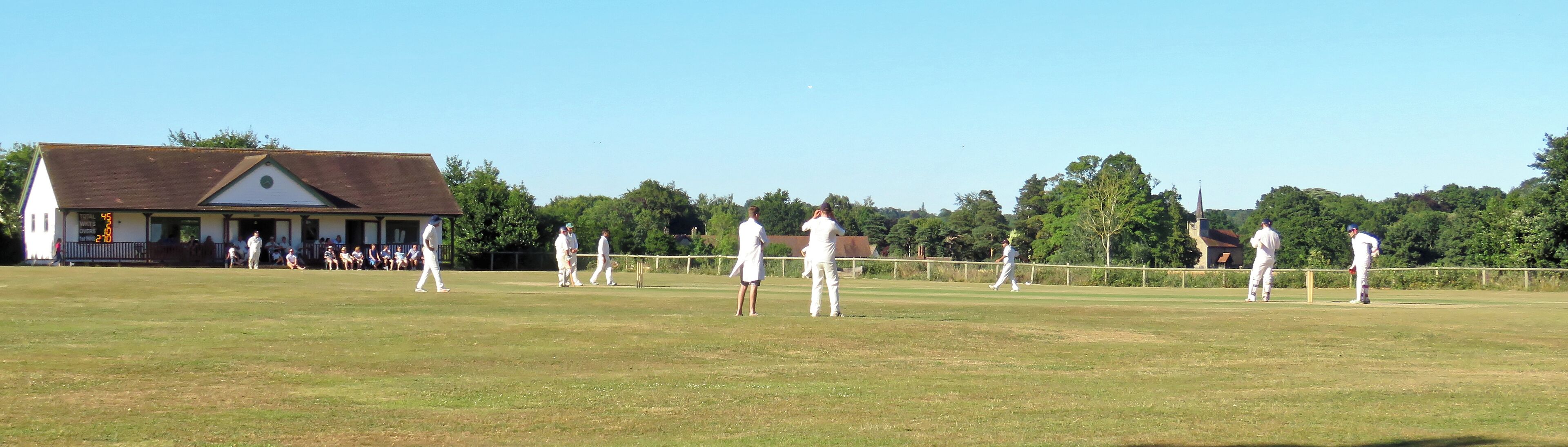 A public Herts and Essex League Saturday cricket game between Little Hallingbury CC and Thorley CC (Thorley batting), at Gaston Green, Little Hallingbury, Essex, England in 2018. Camera: Canon PowerShot SX60 HS Software: File lens-corrected, optimized, perhaps cropped, with DxO PhotoLab, and likely further optimized with Adobe Photoshop CS2.