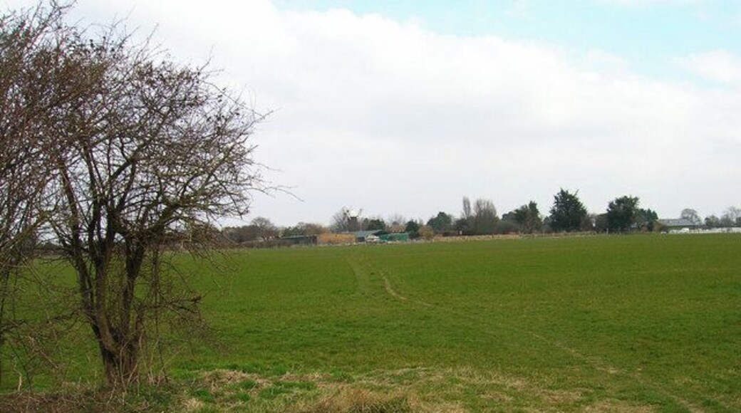 Site of Leys Lane swing bridge, Portsmouth to Arundel Canal. The only surviving remnant is the pivot which can be seen in the centre of the picture. The former lane is now a footpath that links Drove Lane Farm with Barnham windmill which can be seen on the horizon. This view looks north east.