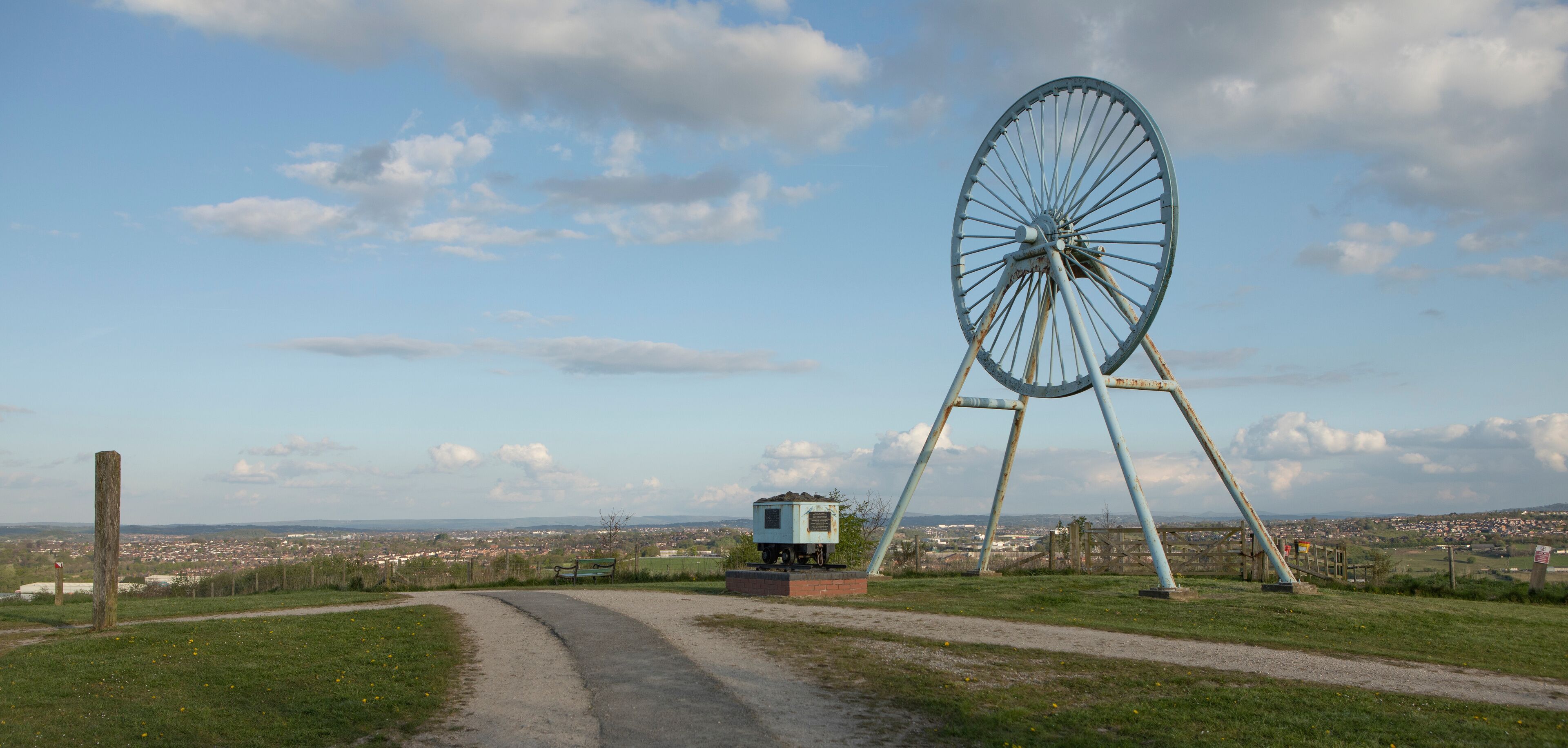 Newcastle-under-Lyme, Staffordshire, uk, 04,25.2022,Apedale pit wheel memorial and coal tub located in Apedale community park, formerly opencast mining