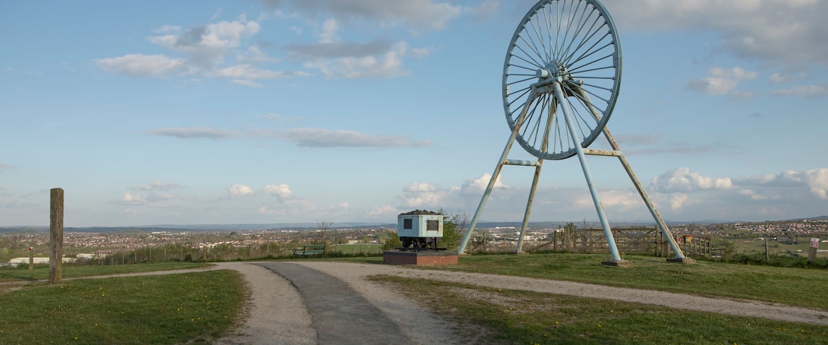 Newcastle-under-Lyme, Staffordshire, uk, 04,25.2022,Apedale pit wheel memorial and coal tub located in Apedale community park, formerly opencast mining