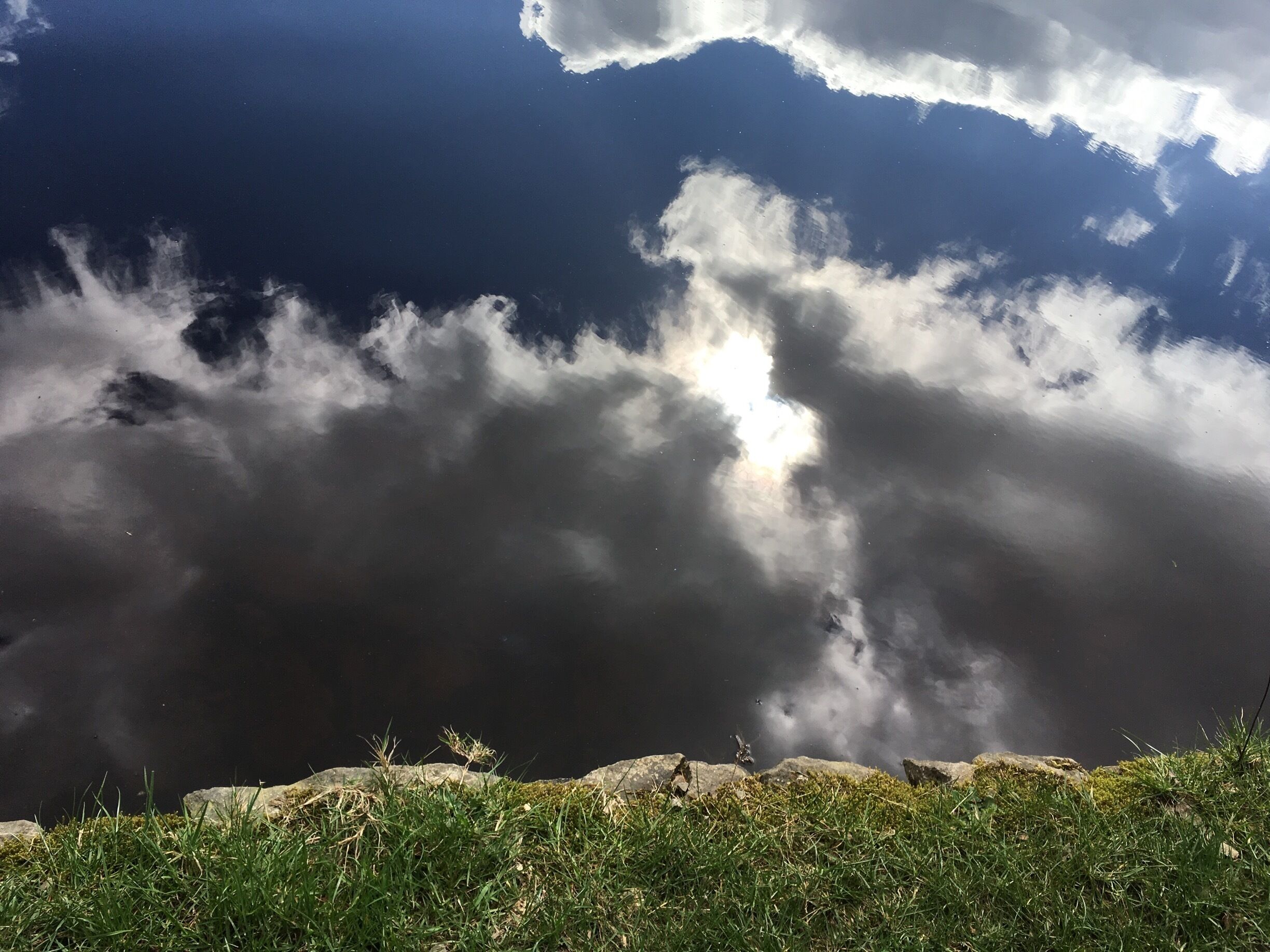 Love love love this pic. This is a photo taken of the reservoir with the reflection of the sun breaking through the clouds. If you look. Lovely you. And see the grass on the edge of the reservoir.
