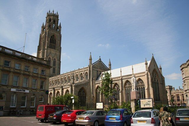 A historic church with a tall tower and arched windows.