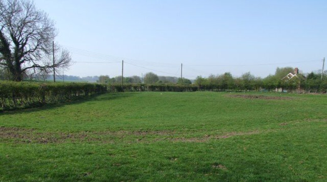 Field by the site of Miningsby church Church cottage can just be seen.