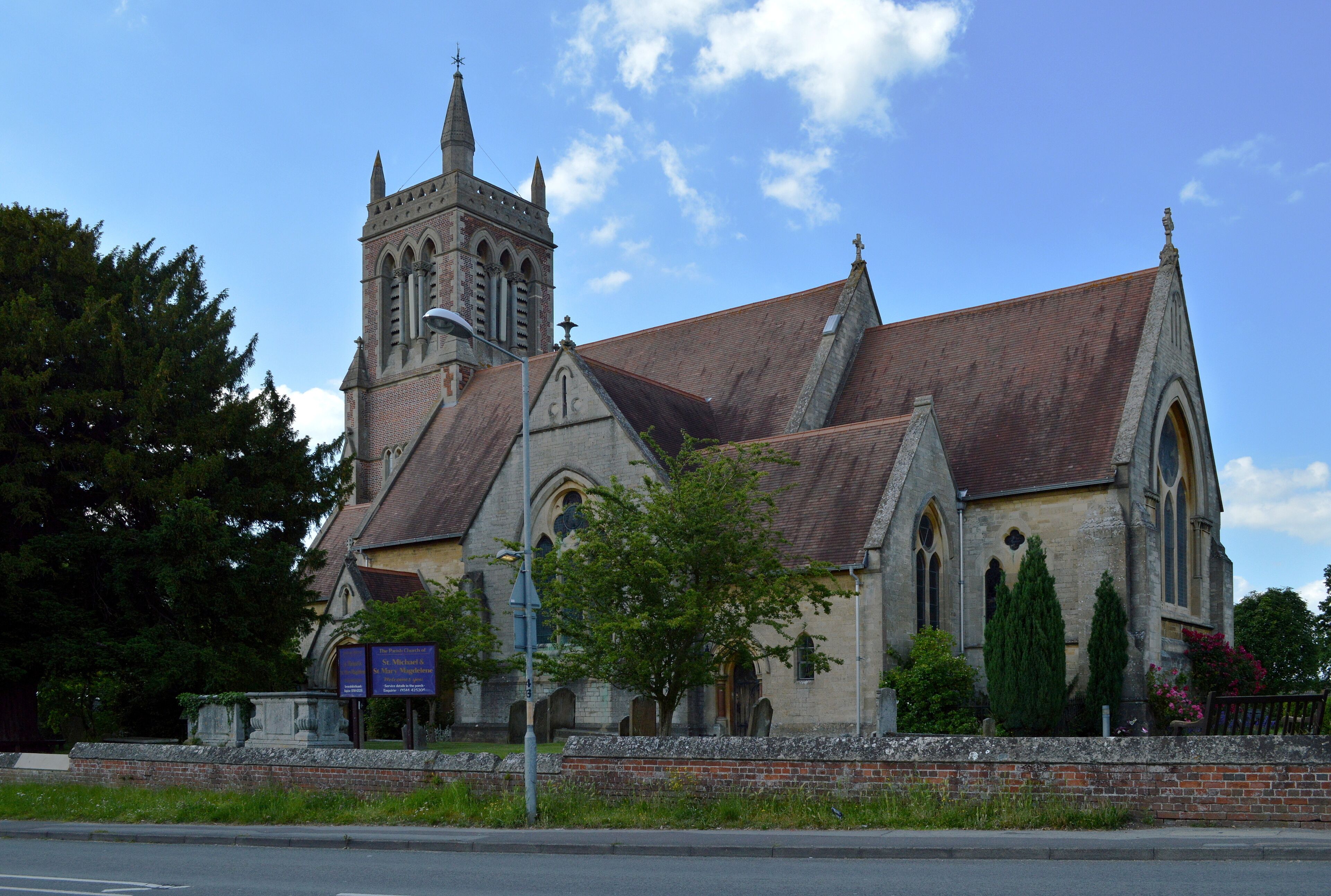 A historic church with a tall tower and arched windows.